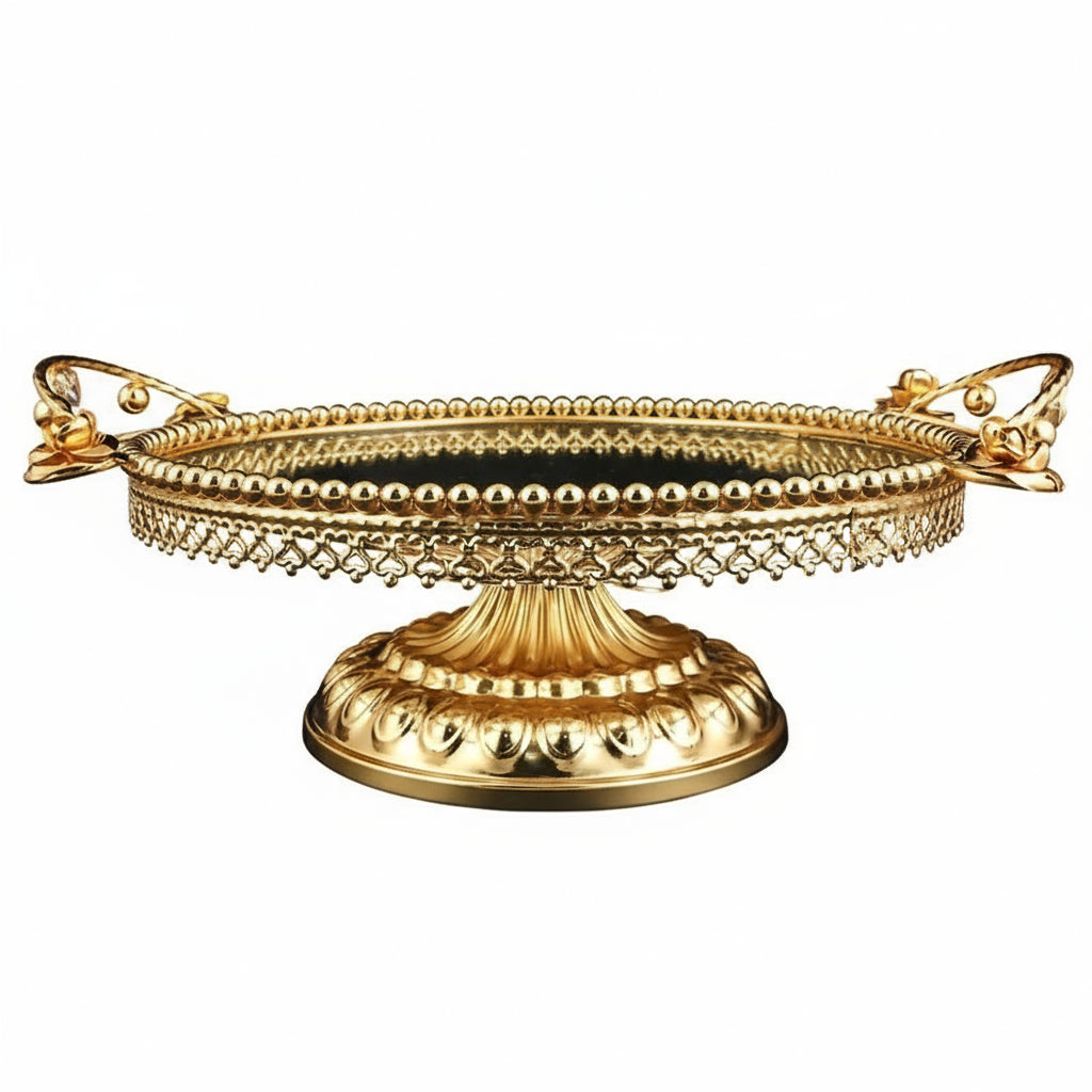 Gold decorative tray with intricate design on a white background